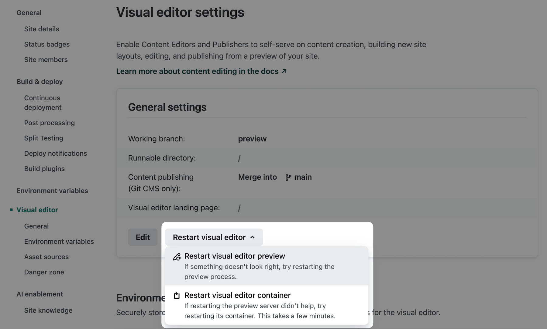 Site configuration UI showing the restart visual editor button and drop-down menu with two restart options to restart the preview or restart the container